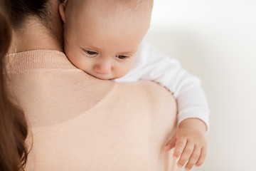 Image showing close up of little baby boy with mother