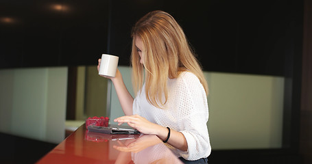 Image showing Blonde drinking coffee enjoying relaxing lifestyle