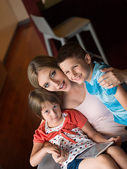 Image showing Young Family Using A Tablet To Make Future Plans