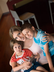 Image showing Young Family Using A Tablet To Make Future Plans