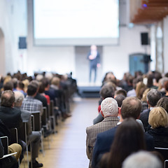 Image showing Business speaker giving a talk at business conference event.