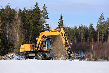 Image showing Hydraulic Excavator at Rural Construction Site in Winter