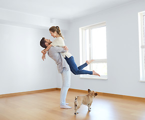 Image showing happy couple at empty room of new home