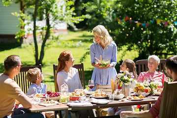 Image showing happy family having dinner or summer garden party