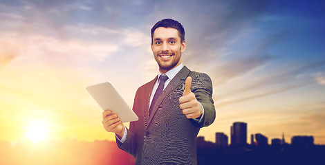 Image showing smiling businessman with tablet pc computer