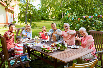 Image showing happy family having dinner or summer garden party