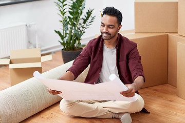 Image showing man with boxes and blueprint moving to new home