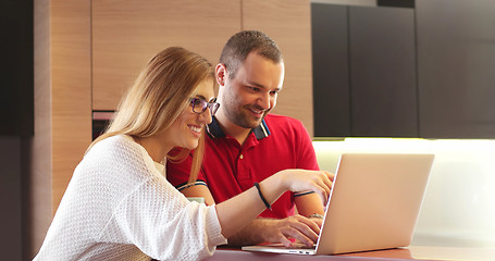 Image showing Couple Using Laptop To Shop Online in modern apartment