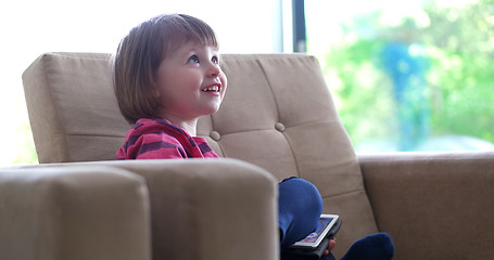 Image showing Child using tablet in modern apartment