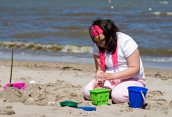 Image showing Girl Making Sand Castle