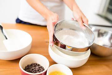 Image showing Sieve the prowder with making cookies