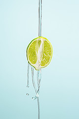 Image showing The essential oil of lemon-Drop of oil falls