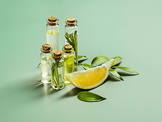 Image showing Lemon oil isolated on white wooden table