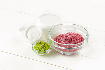 Image showing Spa concept with salt, mint, lotion, towel on white background