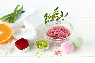 Image showing Spa concept with salt, mint, lotion, towel on white background