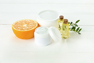 Image showing Spa concept with salt, mint, lotion, towel on white background