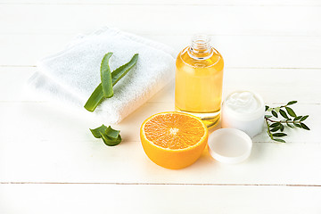 Image showing Spa concept with salt, mint, lotion, towel on white background