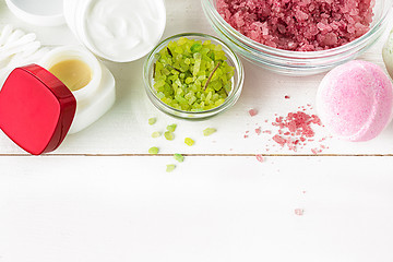 Image showing Spa concept with salt, mint, lotion, towel on white background