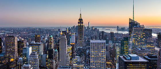 Image showing New York City skyline with urban skyscrapers at dusk, USA.