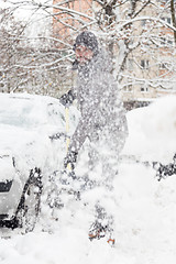 Image showing Man shoveling snow in winter.