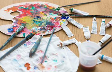 Image showing palette, brushes and paint tubes on table