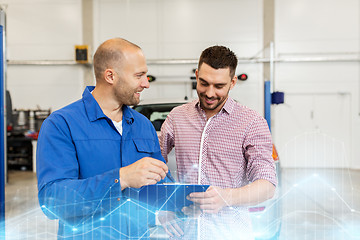 Image showing auto mechanic with clipboard and man at car shop