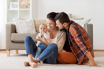 Image showing happy family with baby having fun at home