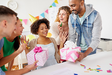 Image showing team greeting colleague at office birthday party