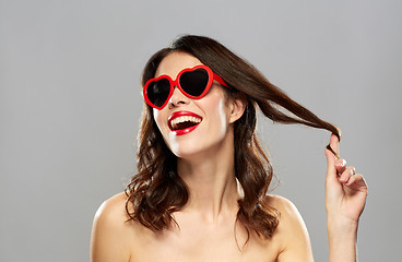 Image showing woman with red lipstick and heart shaped shades