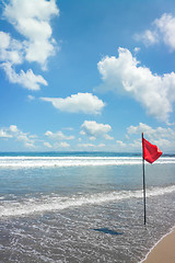 Image showing a beach at Bali with a red flag