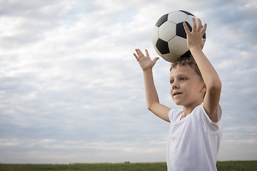 Image showing Portrait of a young  boy with soccer ball.