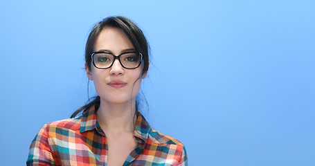 Image showing woman smiling wearing on a pair of large glasses