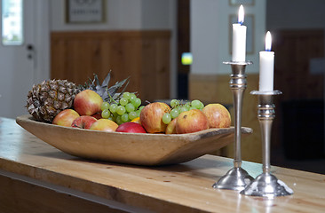 Image showing Candles and fruits in the dining room of a mountain hotel at night, Vålådalen Fjällstation, north Sweden