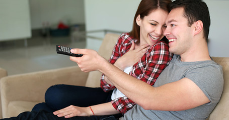 Image showing Young Couple Watching Tv at villa