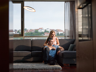 Image showing Attractive Couple Using A Laptop on couch