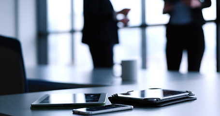 Image showing tablet, mobile cell phone and cup of coffee  in office with busi