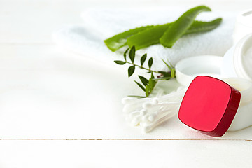 Image showing Spa concept with salt, mint, lotion, towel on white background