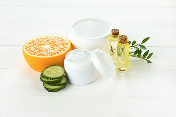 Image showing Spa concept with salt, mint, lotion, towel on white background