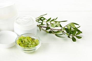 Image showing Spa concept with salt, mint, lotion, towel on white background