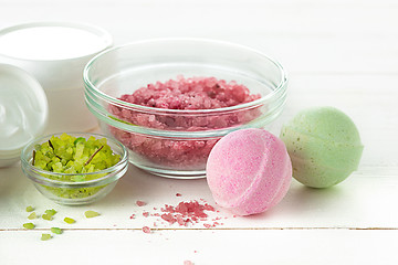 Image showing Spa concept with salt, mint, lotion, towel on white background