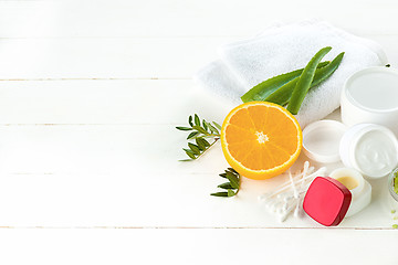 Image showing Spa concept with salt, mint, lotion, towel on white background