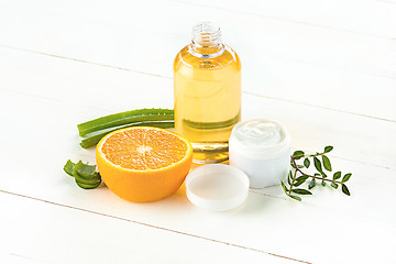 Image showing Spa concept with salt, mint, lotion, towel on white background