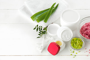 Image showing Spa concept with salt, mint, lotion, towel on white background