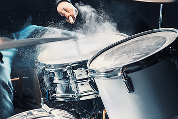 Image showing Drummer rehearsing on drums before rock concert. Man recording music on drum set in studio