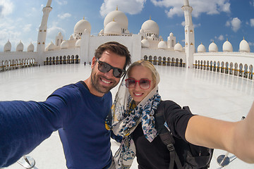 Image showing Couple taking selfie in Sheikh Zayed Grand Mosque, Abu Dhabi, United Arab Emirates.