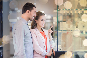 Image showing couple looking to shopping window at jewelry store