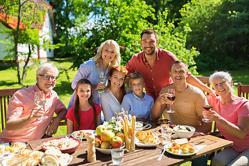 Image showing happy family having dinner or summer garden party