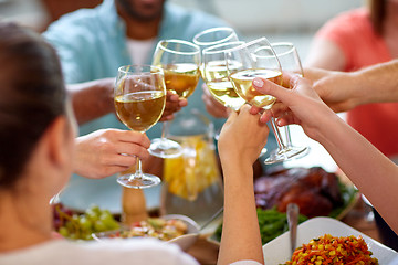 Image showing hands clinking wine glasses