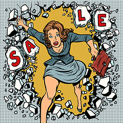 Image showing A woman runs for sales, breaking the wall