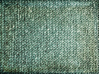 Image showing Grungy faded green knitted background